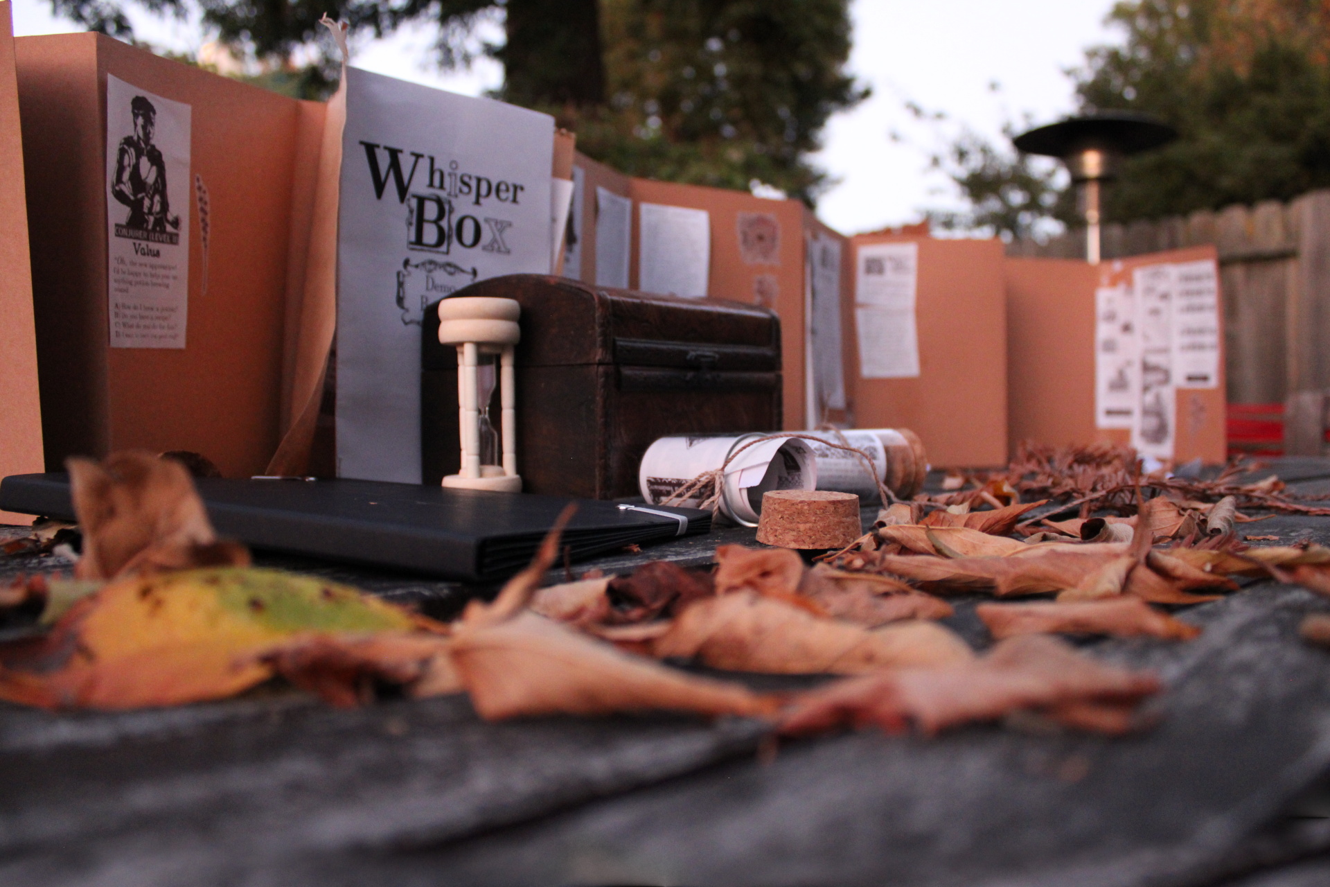 WhisperBox prototype in a cozy fall scene showing the screen-free good life in a backyard in Berkeley